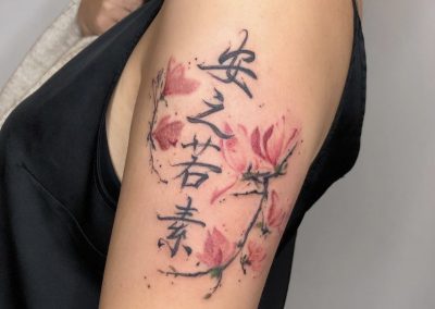 watercolor cherry blossom tattoo with kanji on upper arm by Louise Flowerbloom, Milpitas CA